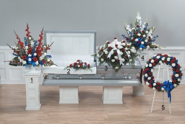 Honor Tribute with red, white and blue flowers features striking blue delphinium