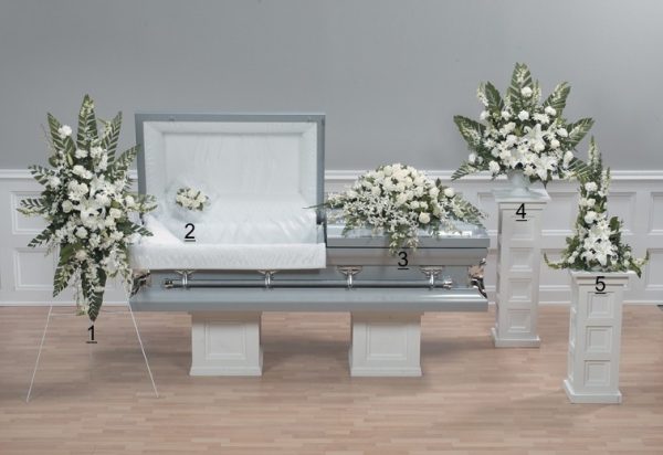 innocence all white funeral flower arrangement with beautiful orchids