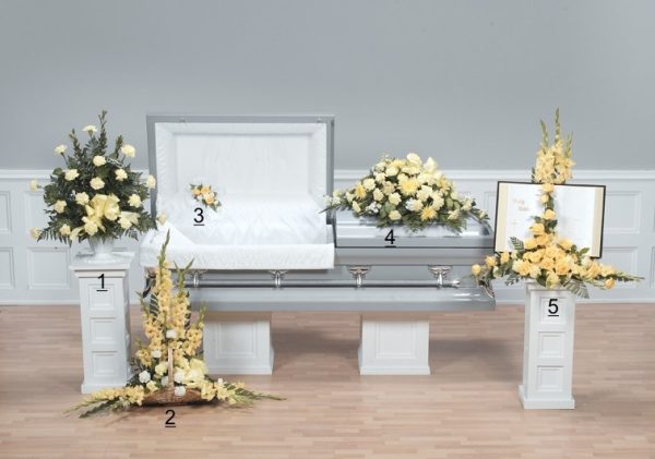 traditional Yellow and White funeral floral tribute with fireside basket