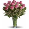 Dozen long stemmed pink rose in a glass vase